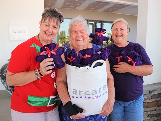 Resident at Arcare Pimpama Donates Knitted Teddies to Community Group STEPS 4208