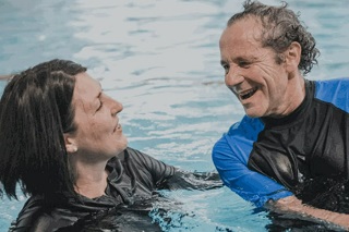 Just Better Care Client John Swims on a Wave of Community Spirit