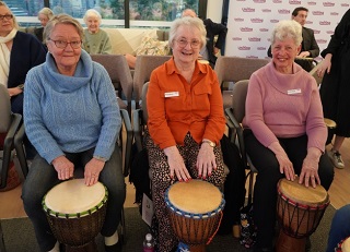 Residents Come Together at New Retirement Village for African Drumming Experience