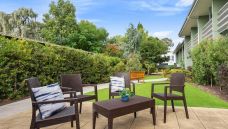 Bupa-Aged-Care-Woodville-courtyard-with-garden-and-home-view