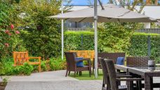 Bupa-Aged-Care-Woodville-rose-bush-and-courtyard-with-garden